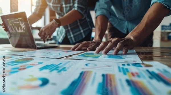 Fototapeta A marketing team analyzing consumer behavior data represented in a graph to develop targeted advertising campaigns.