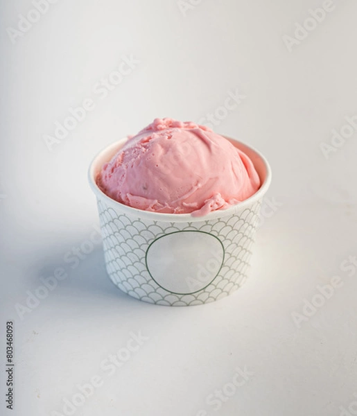 Fototapeta Single scoop strawberry ice cream in a paper glass cup