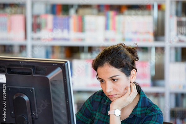 Obraz Studying on a computer at Library