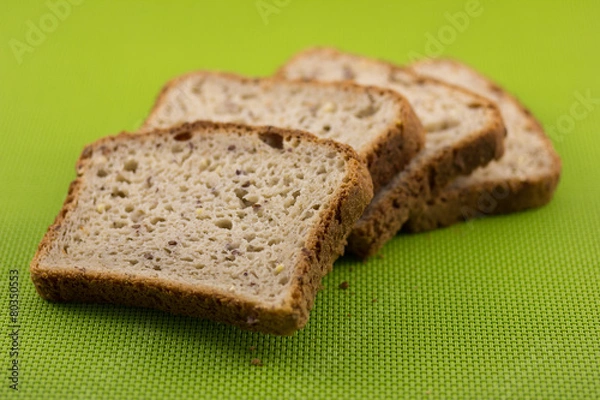 Fototapeta Bread Slices on Green Background