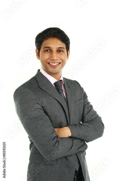 Obraz Portrait of a smiling Indian business man isolated on white.