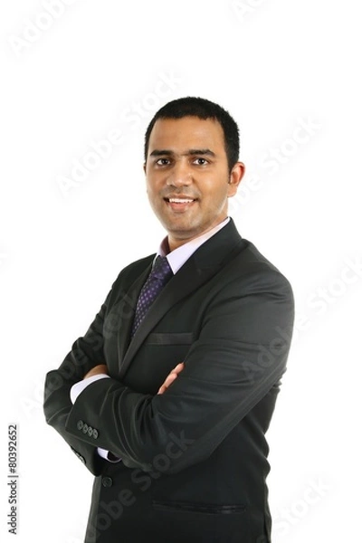 Obraz Portrait of a smiling Indian business man isolated on white.