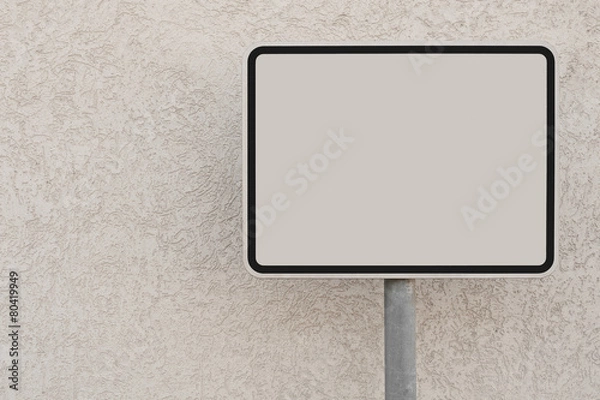 Obraz Ein leeres weisses Schild vor einer weissen Hauswand