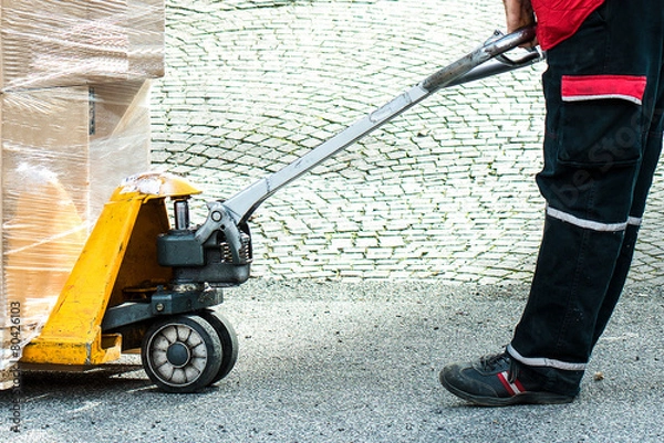 Obraz Carrier moving boxes using a fork lift