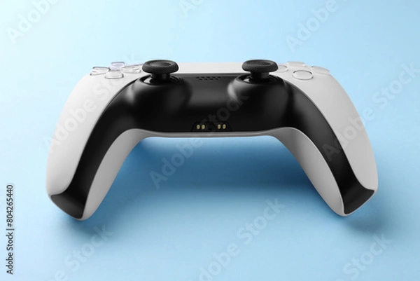 Fototapeta Wireless game controller on light blue background