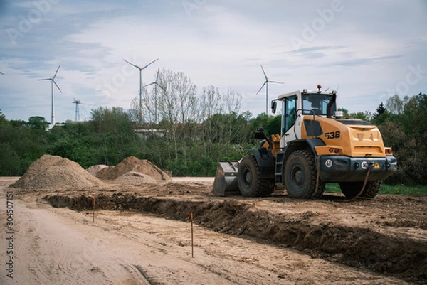 Fototapeta there is a large excavator on a building site