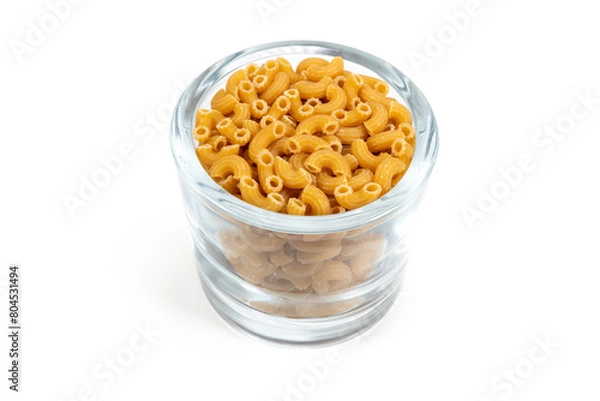 Fototapeta A glass full of rigati macaroni pasta