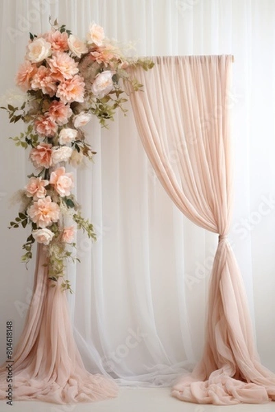 Fototapeta A mesmerizing shot of a meticulously adorned wedding arch, featuring an abundance of exquisite flowers and gracefully draped fabric, creating a captivating scene against a pristine white background.