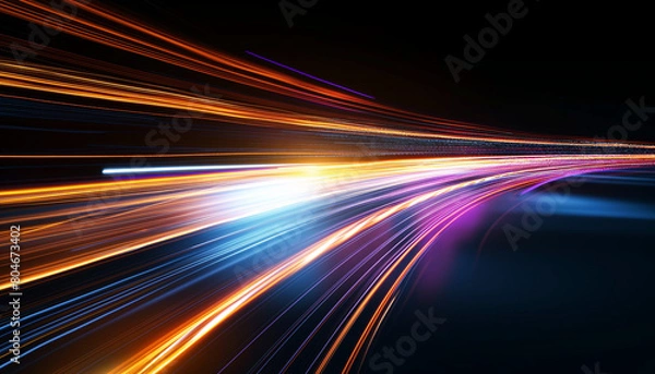 Obraz Colorful light streaks blur across a highway at night, creating an abstract motion effect