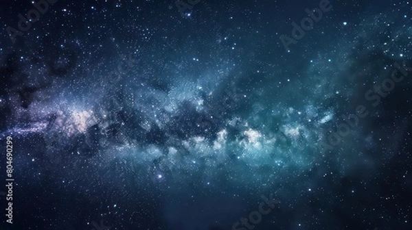Fototapeta The image captures the mysterious and vast expanse of the starry night sky, dotted with cosmic dust and distant celestial bodies