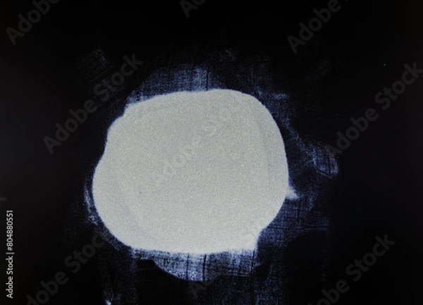 Obraz abstract white dust on a black background.