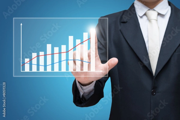 Fototapeta Businessman standing posture hand touch graph finance isolated