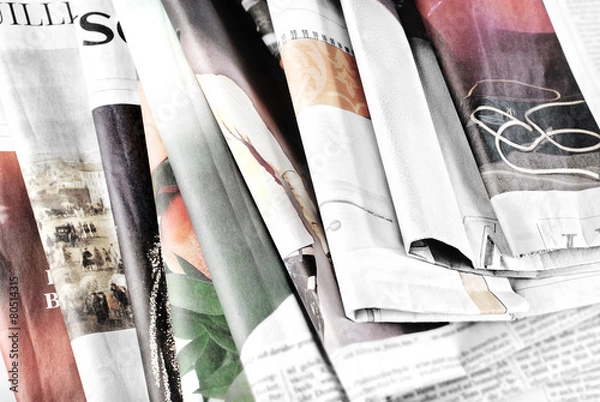 Obraz Old newspapers lying in disorder