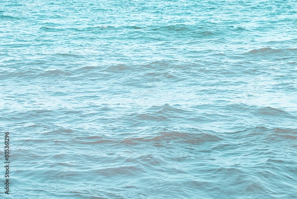 Fototapeta The sea surface has small waves reflecting light.