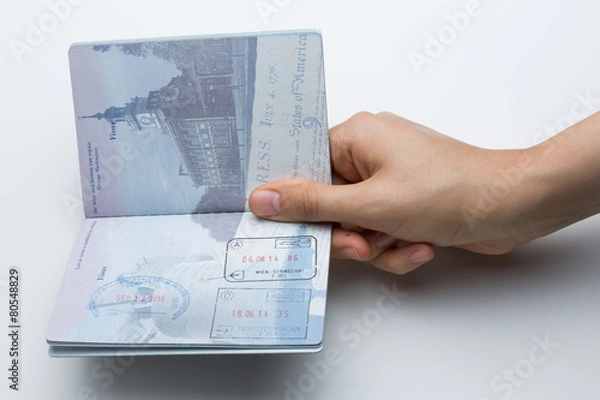 Obraz Holding an Opened American Passport