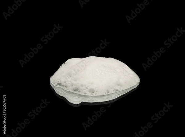 Fototapeta Soap foam on a dark background. Texture of white soap foam
