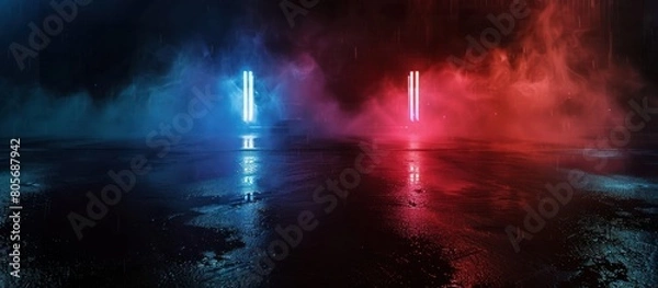 Fototapeta The reflection of the lights on the wet, smoky asphalt in the city