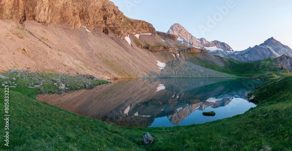 Fototapeta Fantastic sunrise panorama of picturesque little lake in the Swiss alps, Fluhsee, close to Lenk in Bernese Oberland, Europe. Beauty of nature concept background