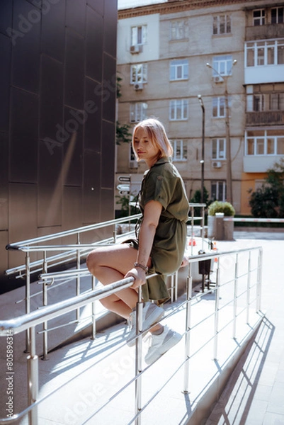 Fototapeta person standing on the roof