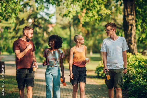 Fototapeta Group of multicultural tourists taking a walk in nature.