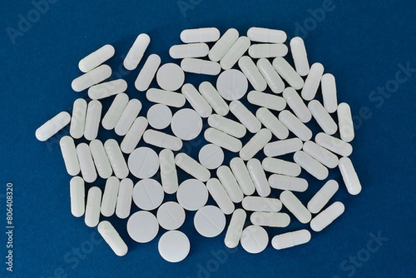 Obraz White pills on blue background