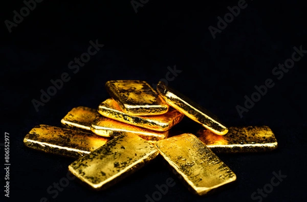 Fototapeta Close up photo a gold bars on black background, copy space