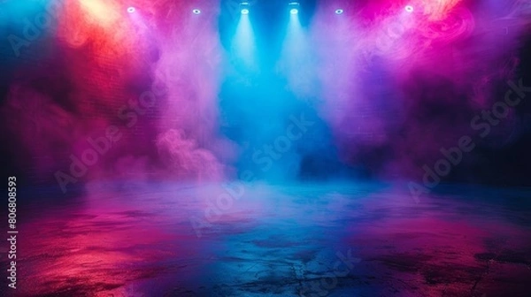 Fototapeta Vivid colors of blue and red spotlights illuminate the stage