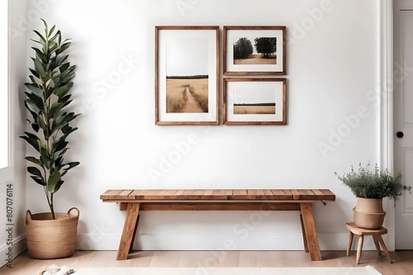 Fototapeta  Wooden rustic bench near white wall with frames. Farmhouse, country, boho interior design of modern home entryway, hall. 