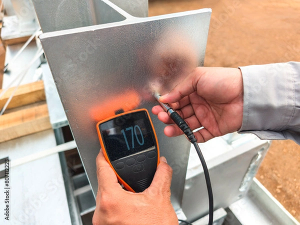Fototapeta Measure the Coating Thickness Galvanized with a Coating Thickness Gauge by Specification of Project for Steel Structure Work at Industrial Factories.