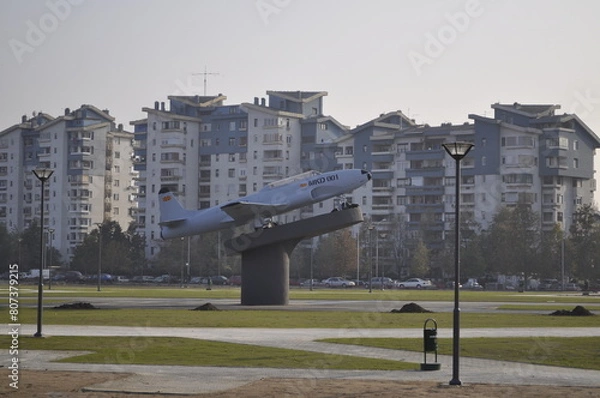 Fototapeta A military plane from the former Yugoslavia on display as a memorial in a park in Skopje, Macedonia.