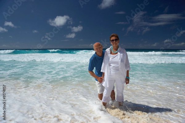 Fototapeta standing in shallow water