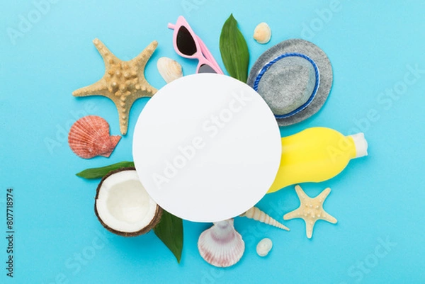 Fototapeta Summer banner with coconut and sea shells on color background. Vacation concept