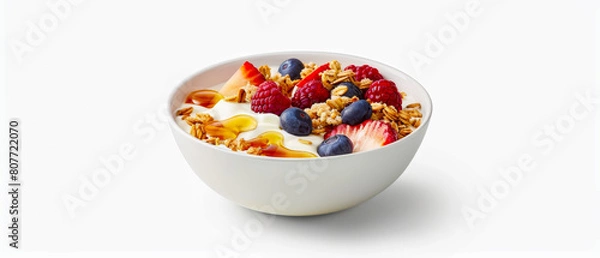 Fototapeta Front view of bowl of cereal with blueberries and strawberries