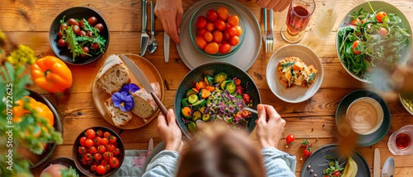 Fototapeta Table with variety of vegetable food, enjoying a healthy and balanced meal