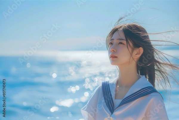Obraz 海辺にいるセーラー服の少女