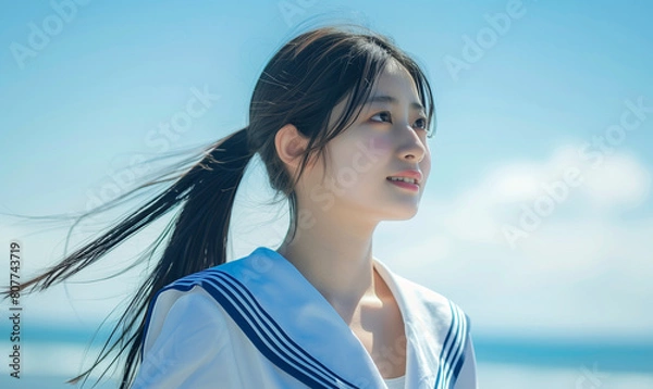 Fototapeta 海辺にいるセーラー服の少女