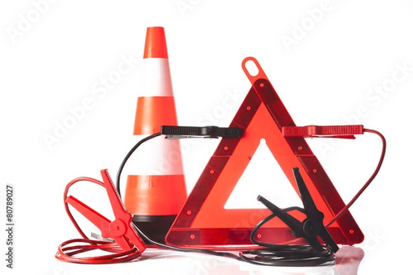 Fototapeta warning triangle and traffic cone with jump start cable