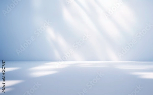 Obraz Light blue minimalistic background for product presentation with beautiful light and shadow on the wall and floor.