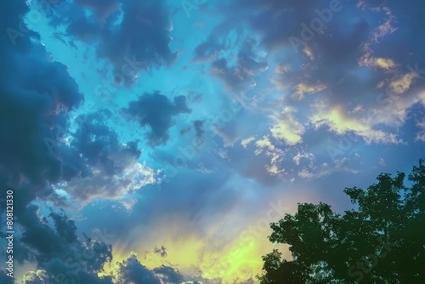 Fototapeta Sunset painting the sky with hues of orange, pink, and purple, signaling the end of summer day