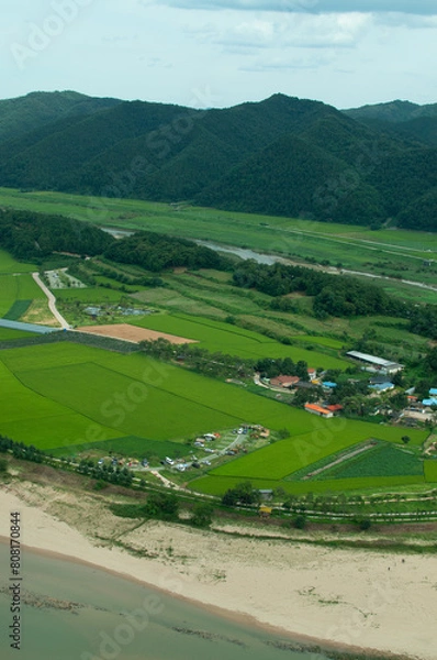 Fototapeta view of a village in river valley