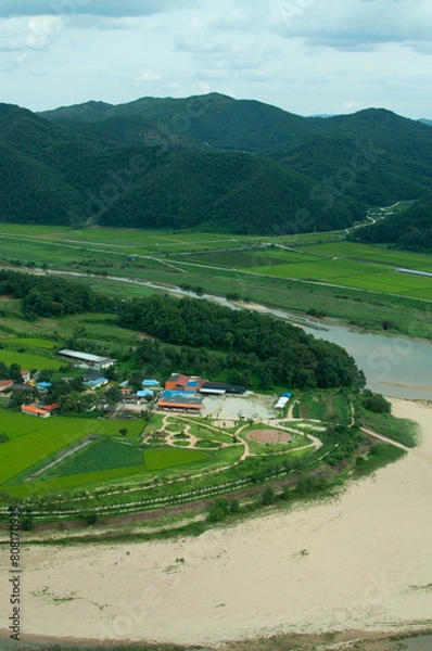Fototapeta view of the countryside with river