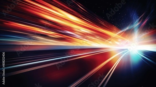 Fototapeta A blurred highway at night, with streaks of light from passing cars creating dynamic lines