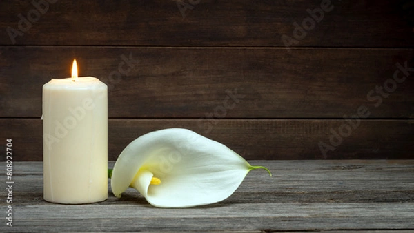 Obraz LIGHTED CANDLE AND CALLA FLOWER ON WOODEN BACKGROUND. DEAD DAY, FUNERAL, ALL SOULS DAY. COPY SPACE.	