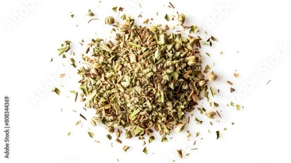 Fototapeta A top view of dried oregano scattered loosely, showcasing the small, crumbled pieces and their earthy color on a white background