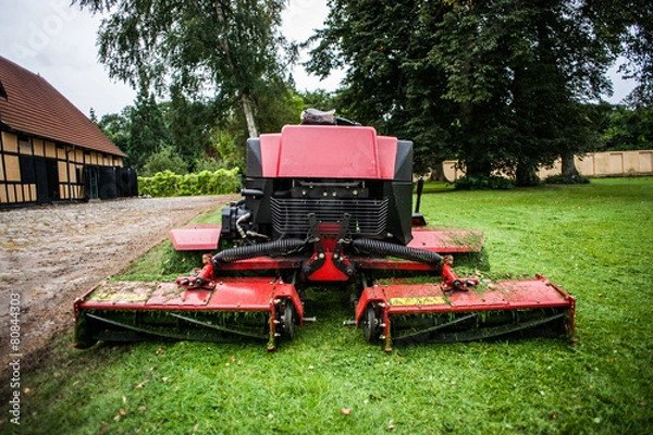 Obraz Lawn mower tractor and grass