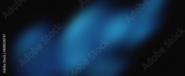 Fototapeta Blue gradient background grainy glowing blue light on dark backdrop noise texture effect banner header design.
