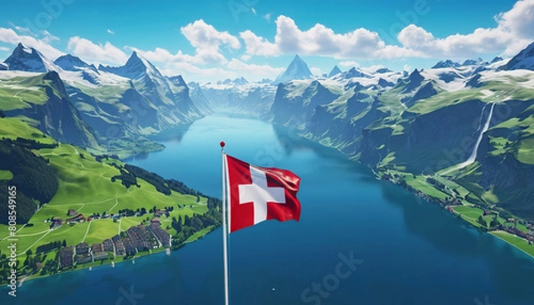 Fototapeta Swiss flag and mountain range on a sunny summer day with blue sky and clouds. Confederation Day is a national holiday in Switzerland