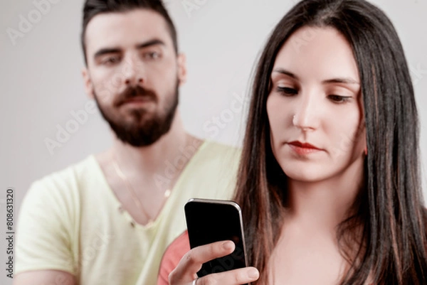 Fototapeta Relationship strain shown through smartphone scrutiny