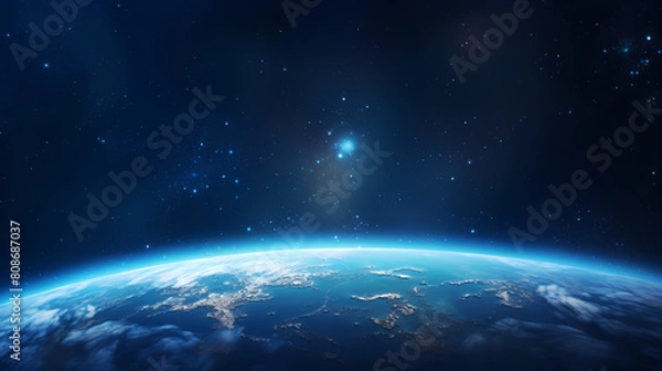 Fototapeta Earth planet glowing in space on starry sky background