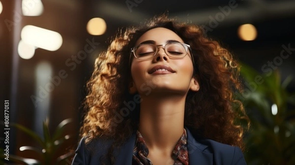 Fototapeta Joyful Businesswoman Enjoying a Break in a Modern Office Setting